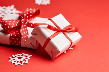 Christmas gift boxes with white snowflakes on red