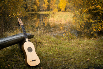 Renaissance guitar in a autumn garden