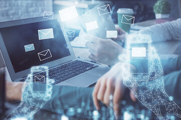 Double exposure of man and woman working together and envelop hologram drawing. e-mail concept. Computer background.