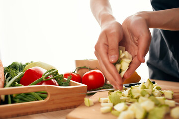 cutting vegetables on a cutting board kitchen cooking