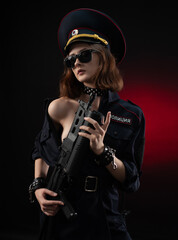 naked girl in a police uniform with a gun . English translation of the police