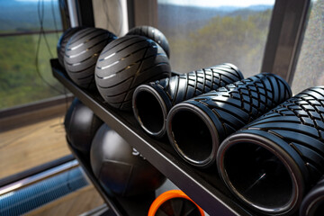 Balls and foam roller sport equipment in a gym