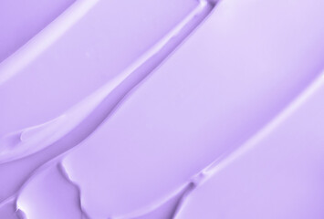 Close-up light violet cream lotion moisturiser smear smudge wavy texture. Skincare and body beauty...