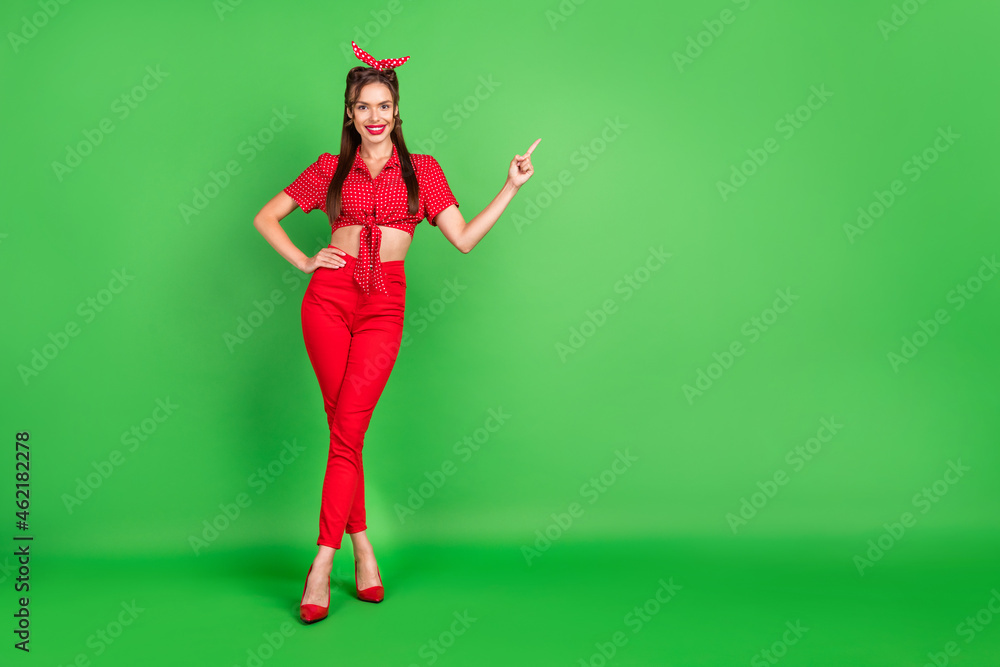 Poster full length body size photo woman in red outfit smiling showing finger copyspace isolated bright gre