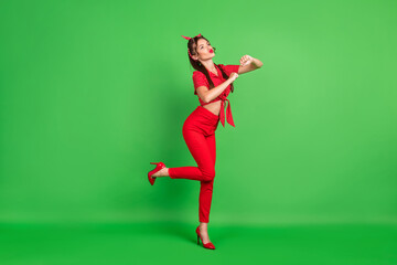 Fototapeta na wymiar Full length body size photo woman dancing at party with pouted lips isolated bright green color background