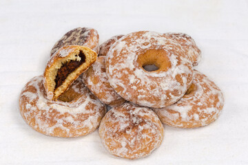 Glazed spice cookies with jam filling and ring shaped cookies