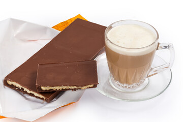 Bar pieces of milk chocolate with filling and coffee drink