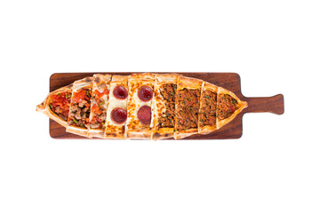 Pide, karisik pide, mixed pita. Turkish pide with sucuk sausage, meat and cheese. Turkish pizza....