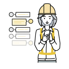 立ってスマートフォンで楽しくチャットで会話する工事現場の女性