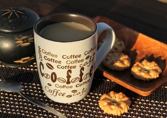 Coffee and sweet biscuits on a table - still life