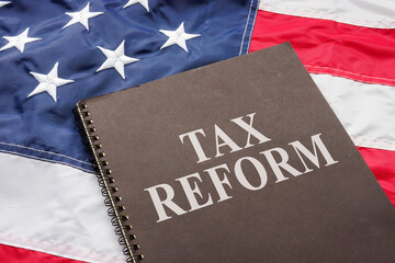 Fototapeta na wymiar Tax reform documents are on the USA flag.