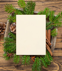 Fototapeta premium Christmas Composition with a blank card and envelope on wooden table