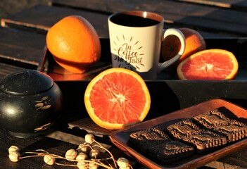 Healthy snack - a still life with oranges and sweet crackers on a table