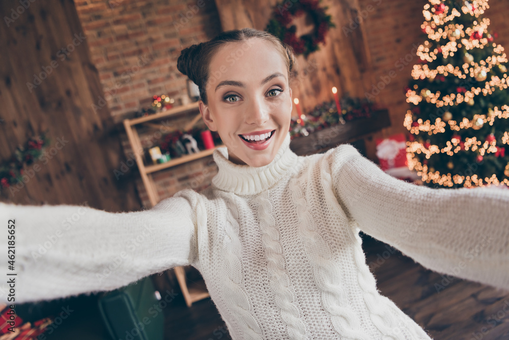 Poster Photo of adorable funny young woman dressed knitted sweater recording self video smiling indoors room home house