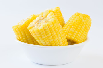 Pieces of boil corns in white bowl