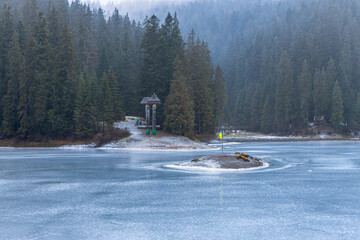 A panoramic view of a high mountain lake Synevir located in the Carpathian Mountains, Ukraine. Shot made in winter