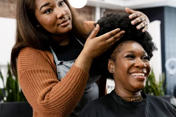 Keuken foto achterwand Schoonheidssalon Customer getting a hairdo at a beauty salon