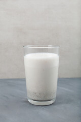 Misutgaru or Misugaru Latte in tall glass. Healthy drink.  Protein smoothie with roasted multi-grain powder. Popular Korean breakfast milkshake