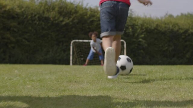 Tracking Shot of Group of Children Playing Football 06
