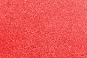 Old cement wall outside the building, painted red, smooth surface texture and background seamless