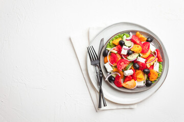 Greek salad with fresh vegetables, feta cheese and black olives. Healthy food. Top view 