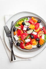Greek salad with fresh vegetables, feta cheese and black olives. Healthy food. Top view 