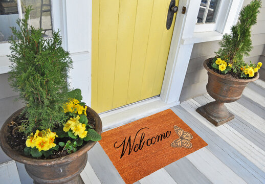 Beautiful welcome peach color coir doormat with Butterfly Placed outside door