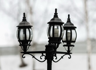 Fototapeta na wymiar Street lamp close-up on a white background in winter