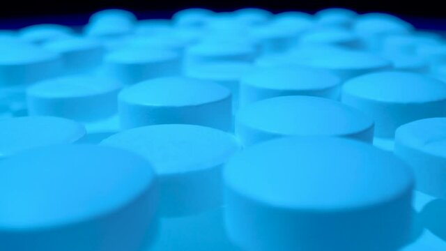Macro shot of medications tablets drugs. Treatment pharmacology oncept.