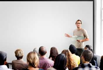 Guy giving a presentation to an audience - obrazy, fototapety, plakaty