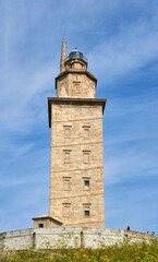 Fototapeta premium the Tower of Hercules with tourists and visitors at the base waiting to enter to see it