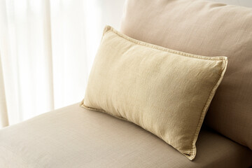 Beige cushion home decor, on a sofa