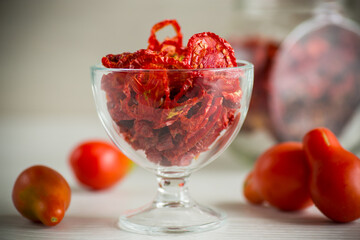 a handful of dried tomatoes and fresh tomatoes