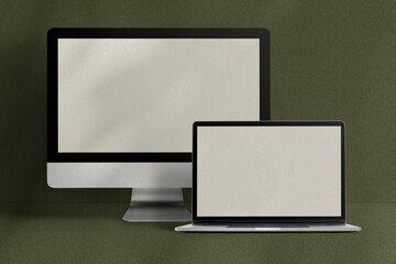 Desktop and laptop screen computer digital device on green background
