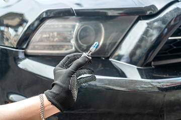 closeup of repair car light bulbs