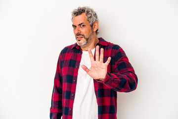 Middle age caucasian man isolated on white background  being shocked due to an imminent danger