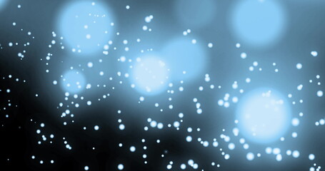 Image of multiple glowing spots of light moving in hypnotic motion on blue background