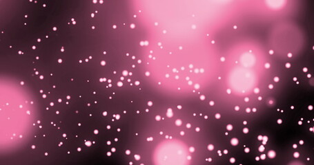 Image de plusieurs taches roses brillantes de lumière se déplaçant dans un mouvement hypnotique sur fond rose