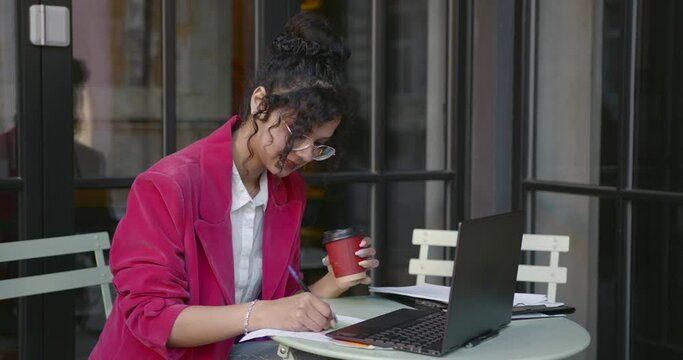 Young freelancer woman work at the cafe