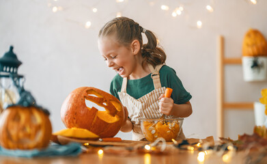 girl with carving pumpkin