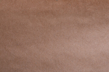 Fototapeta premium Texture of kraft paper bag as background, closeup