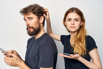 Man and woman with a phone in hand emotions Studio Lifestyle