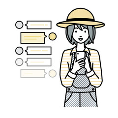 立ってスマートフォンで楽しくチャットで会話する農家の女性