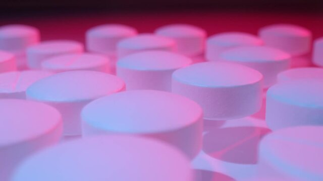 Macro shot of medications tablets drugs. Treatment pharmacology oncept.
