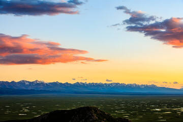 Bayinbuluke grassland natural scenery in Xinjiang at sunset,China.