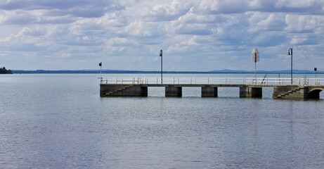A small pier on Lake Trasimeno in front of the Polvese Island (Umbria, Italy, Europe) - 462221413