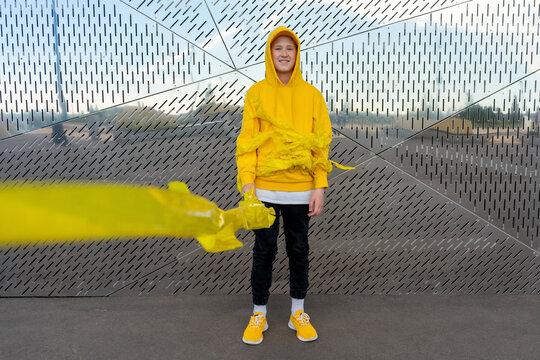 Boy wrapped in yellow adhesive tape