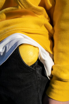 Boy with lemon in pocket