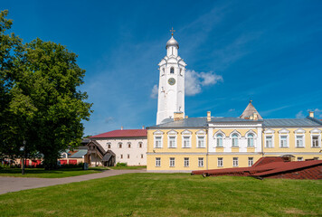 Clock tower of the Novgorod Kremlin. Church of St. Sergius of Radonezh at Vladychny Dvor on the territory of Novgorod Detinets.