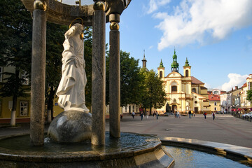 Fototapeta premium Morning view to Roman Catholic Church of Virgin Mary in historic center of Ivano-Frankivsk, Ukraine. September 2021
